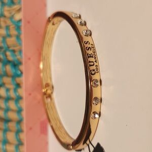 GUESS Gold Bracelet with Clear Stones Logo Accent